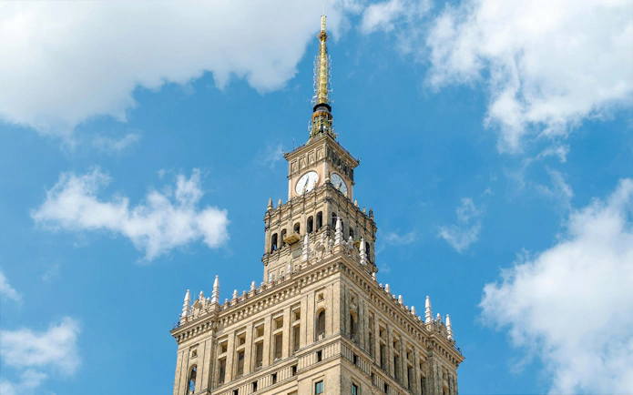 Palace of Culture and Science tower against blue sky, Warsaw, Poland.