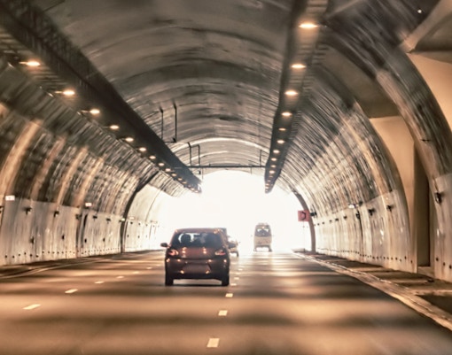 Cars driving through a mountain tunnel in Rio de Janeiro.