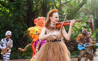 Performers in animal costumes playing instruments at Chimelong Safari Park.