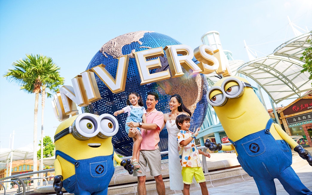 Family enjoying Universal Studios Singapore with Minion characters.