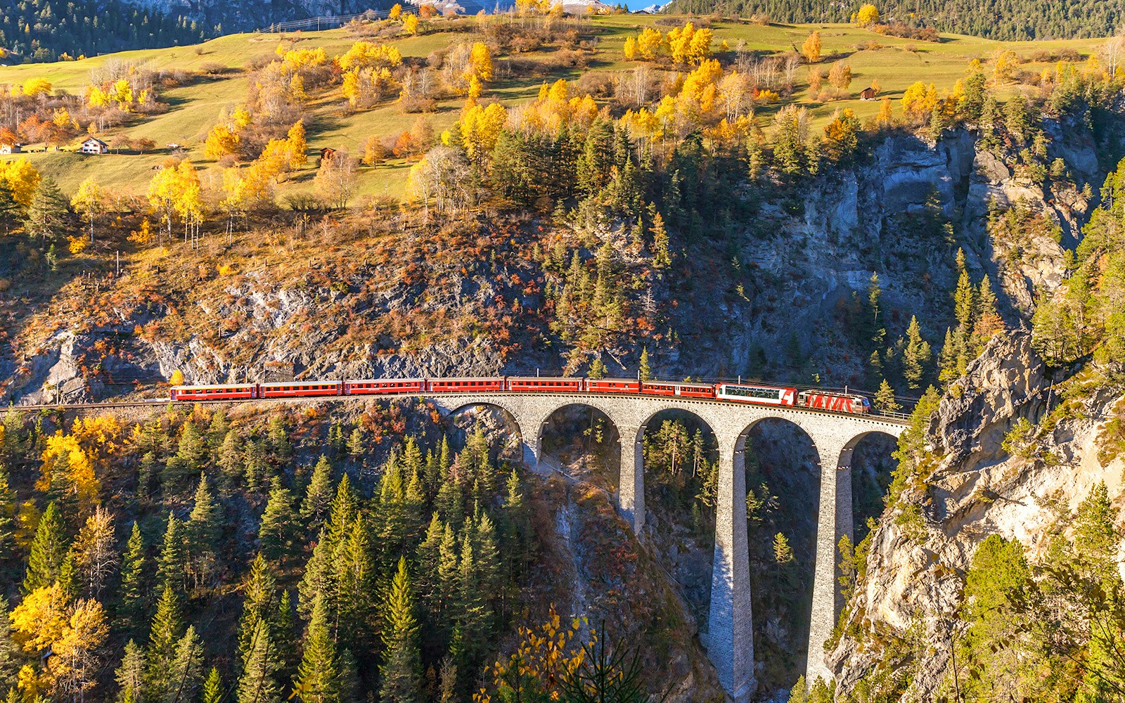 Red Train running on Landvasser Viaduct, Switzerland