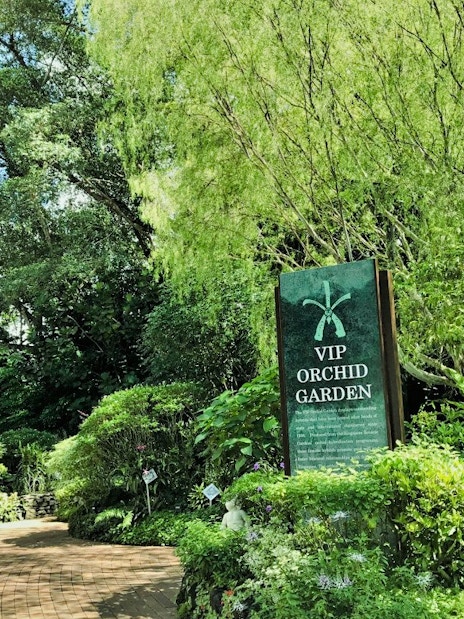 VIP Orchid Garden entrance surrounded by lush greenery at National Orchid Garden, Singapore.