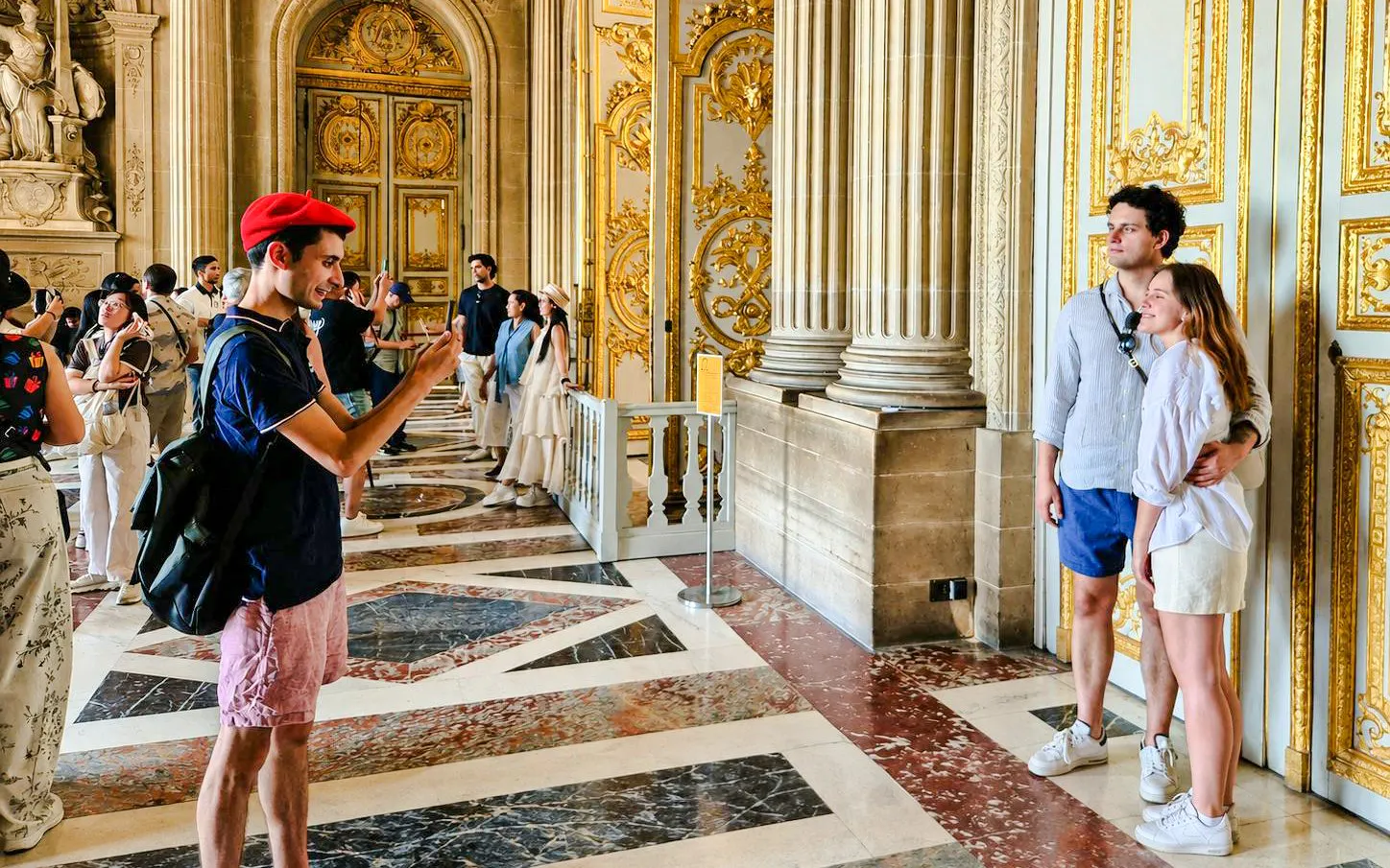 Visitors exploring the ornate interiors of Versailles Palace during a private guided tour.