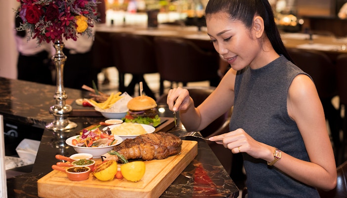Steak dinner served at a restaurant table.