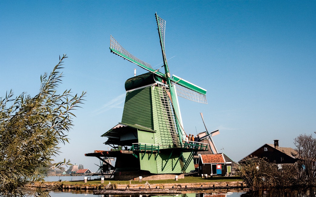 Windmill at Zaanse Schans with clear blue sky in the Netherlands.