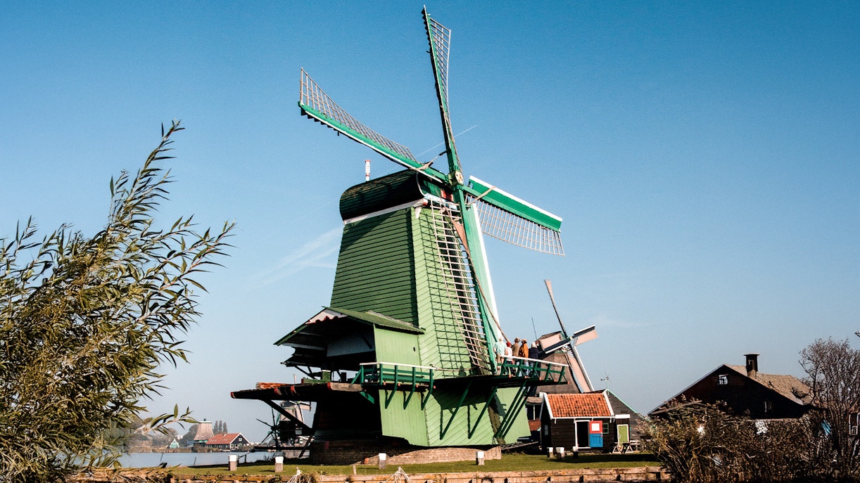 Windmill at Zaanse Schans with clear blue sky in the Netherlands.