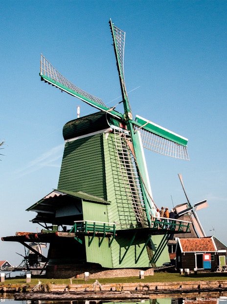 Windmill at Zaanse Schans with clear blue sky in the Netherlands.