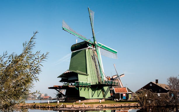 Windmill at Zaanse Schans with clear blue sky in the Netherlands.