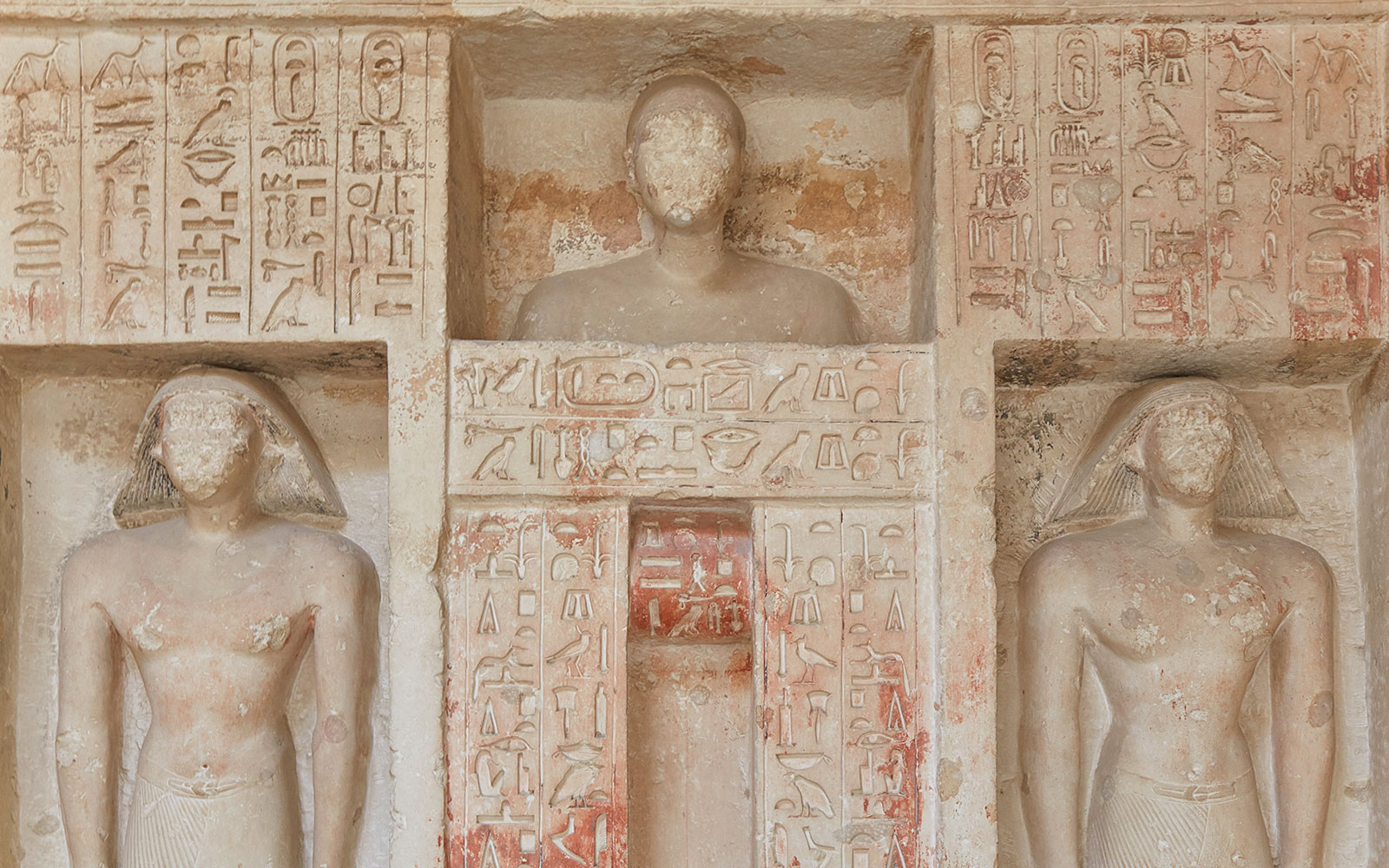 Ornate carvings and hieroglyphs from an Old Kingdom tomb in Saqqara, Egypt.