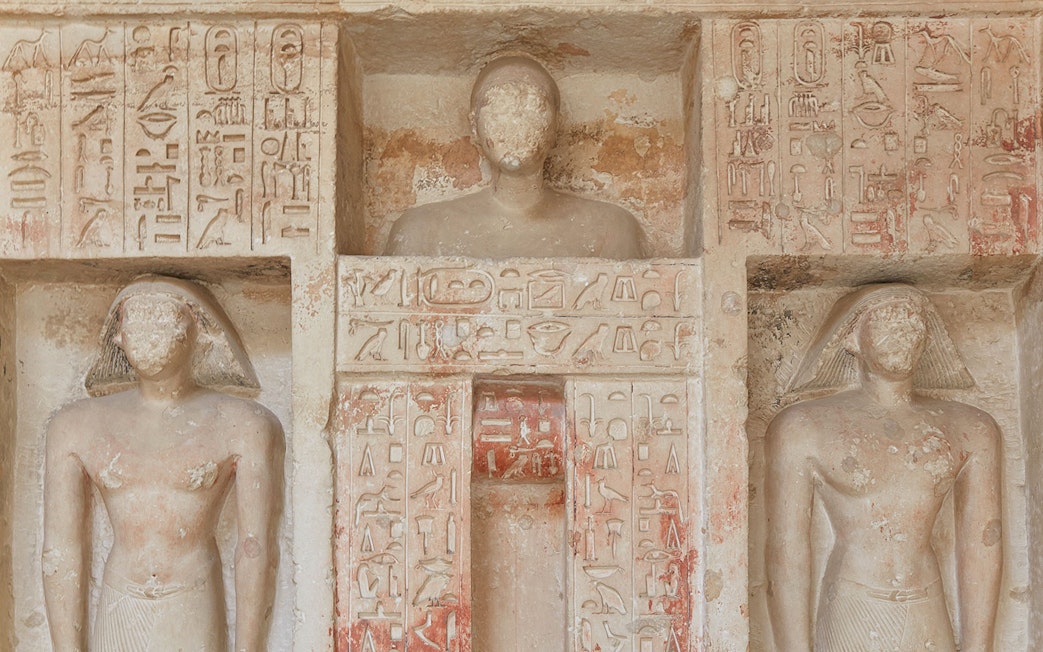 Ornate carvings and hieroglyphs from an Old Kingdom tomb in Saqqara, Egypt.