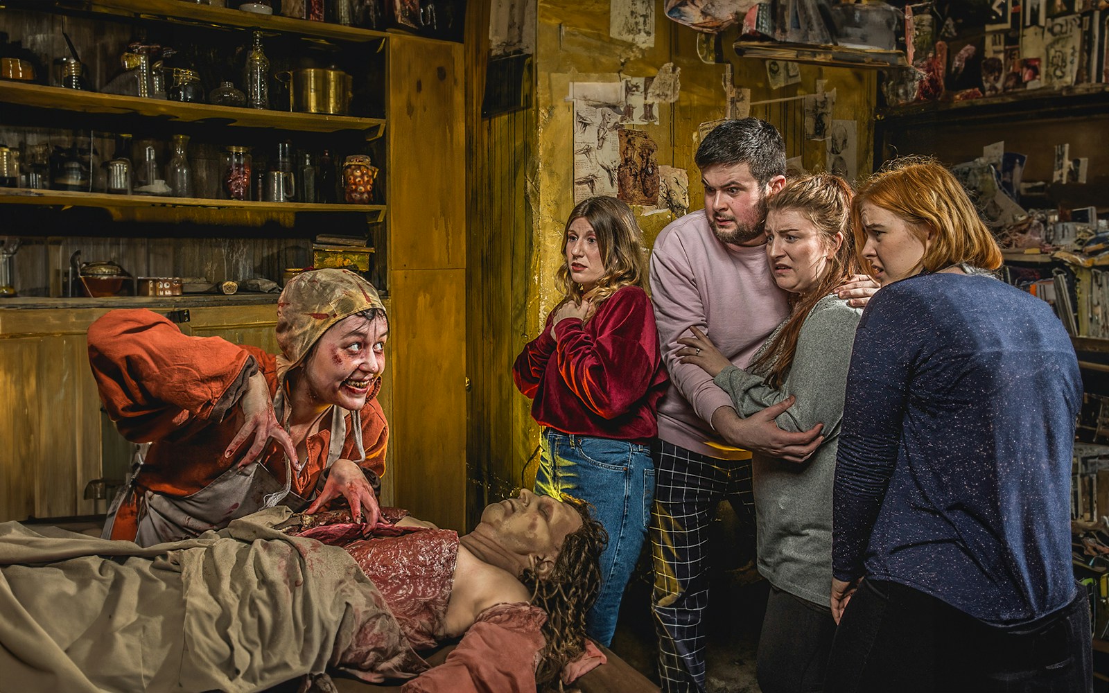 Group reacting to a performer in the Anatomy Theatre at the Edinburgh Dungeon.