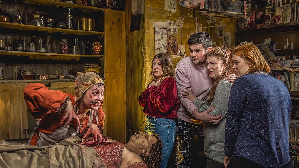 Group reacting to a performer in the Anatomy Theatre at the Edinburgh Dungeon.