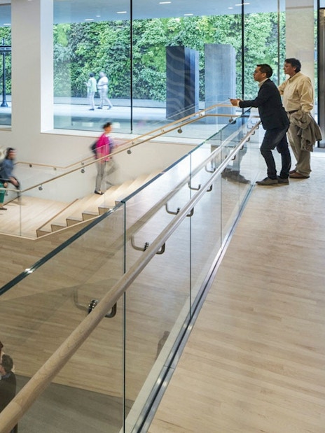 Visitors inside San Francisco Museum of Modern Art with modern architecture and art displays.