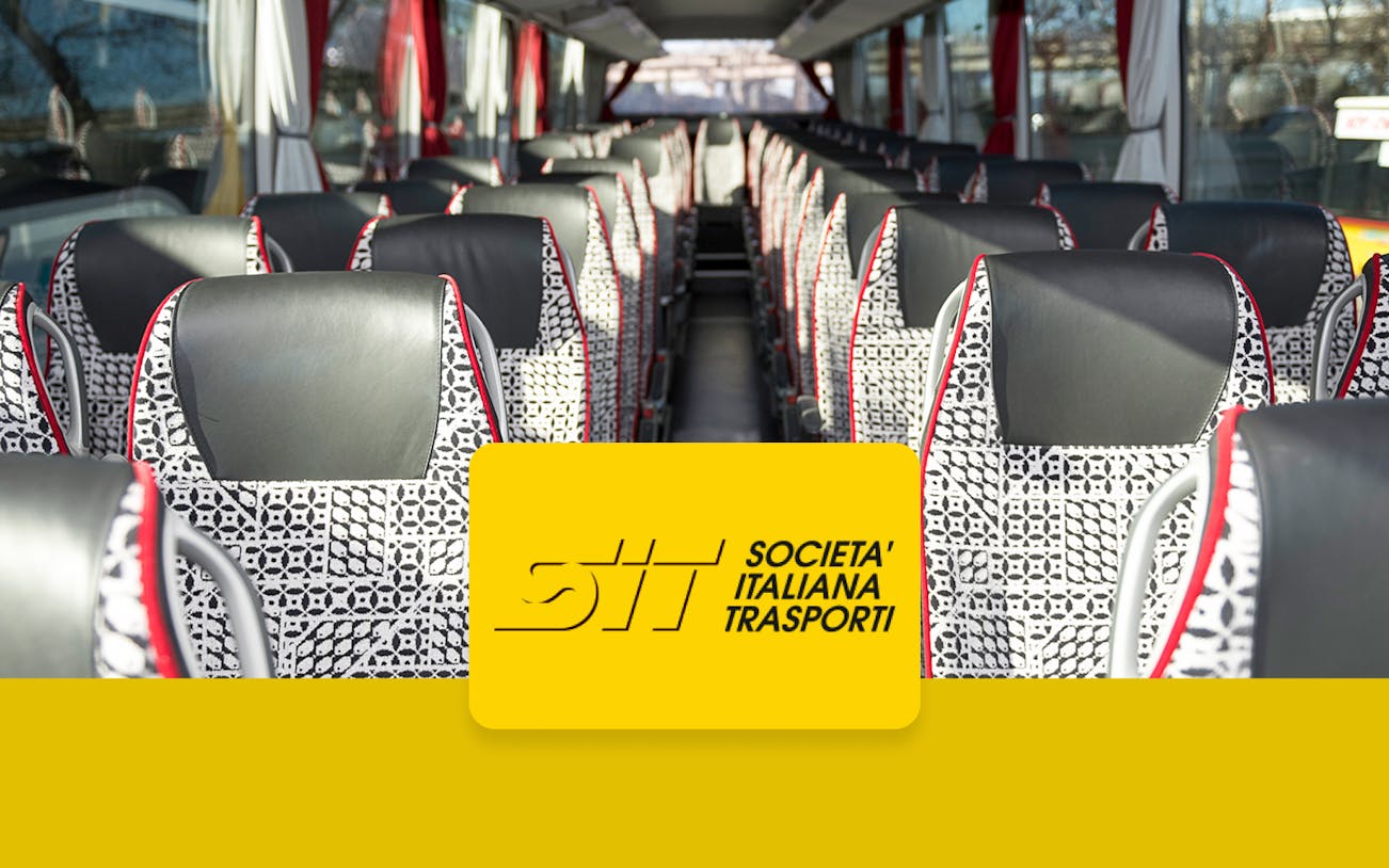 Shuttle bus interior with patterned seats, Società Italiana Trasporti logo.