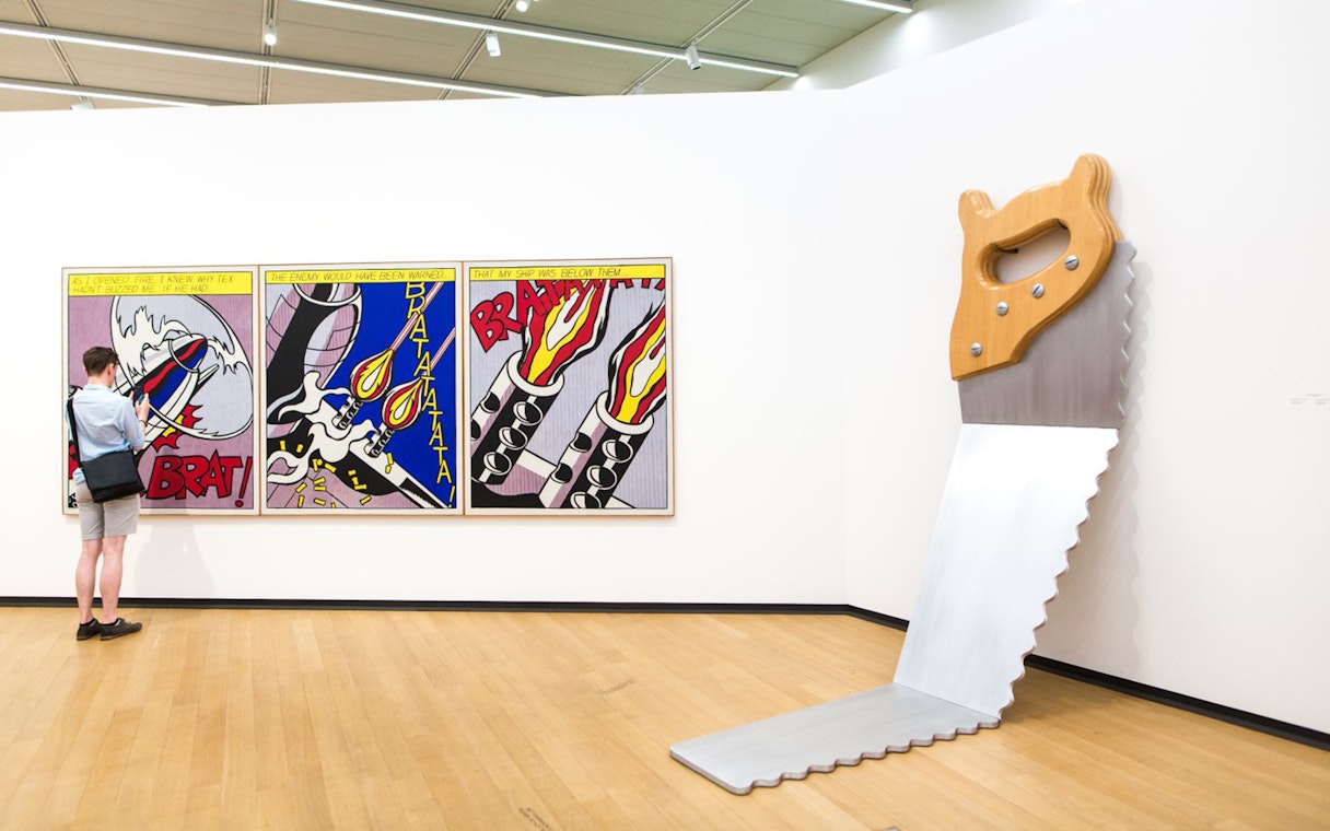 Visitor viewing pop art at Stedelijk Museum, Amsterdam.