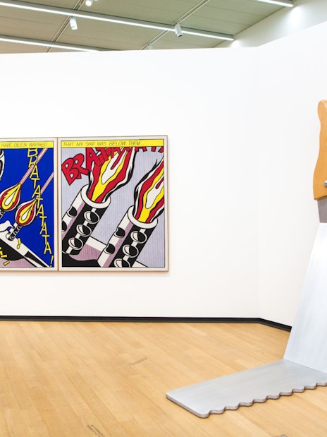 Visitor viewing pop art at Stedelijk Museum, Amsterdam.