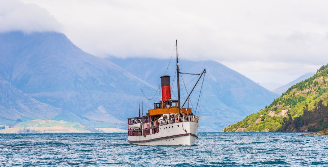 Lake Wakatipu cruise with scenic mountain views in Queenstown, New Zealand.