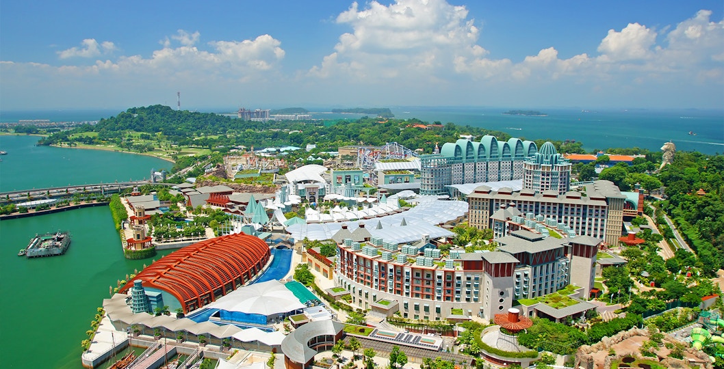 Aerial view of Resorts World Sentosa on Sentosa Island, featuring hotels and attractions.