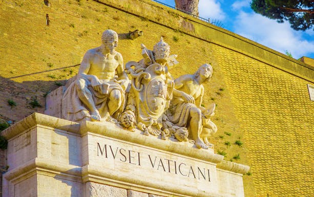 Vatican Museums entrance with sculptures, Rome.