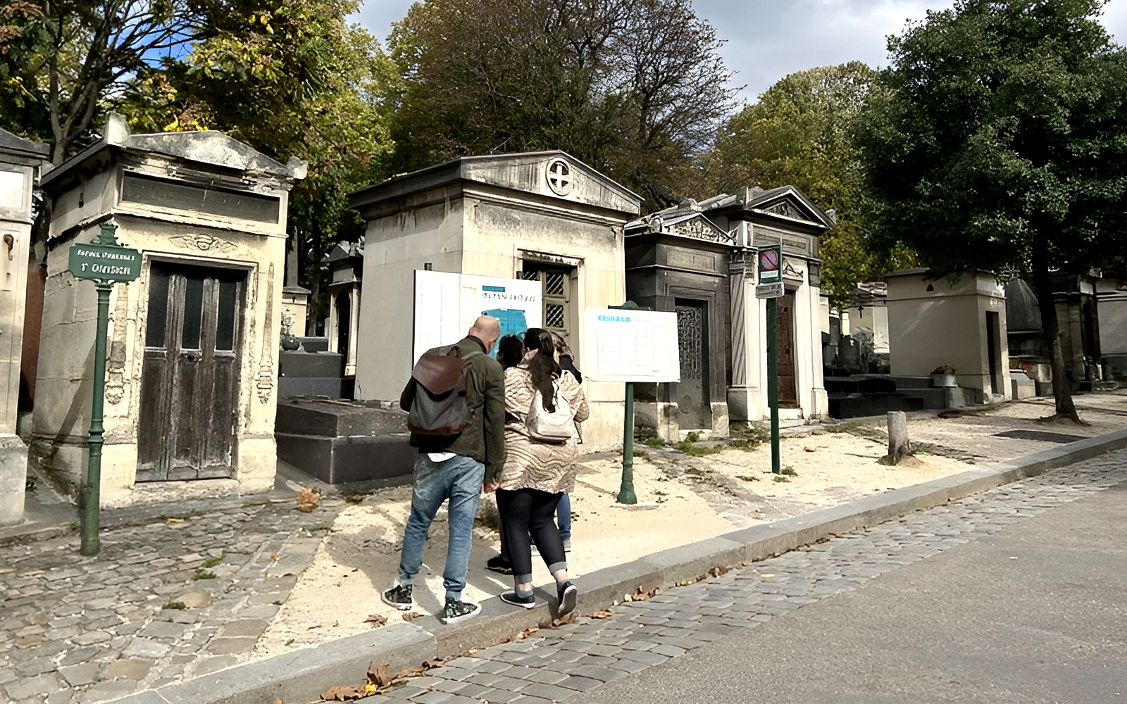 Père Lachaise Cemetery tombstones and pathways on a haunted guided tour in Paris, France.