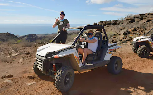 Off-road buggy tour in Gran Canaria with ocean view in the background.