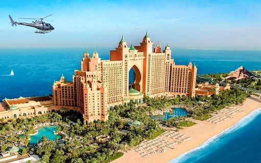 Helicopter flying over Atlantis, The Palm in Dubai with ocean view.