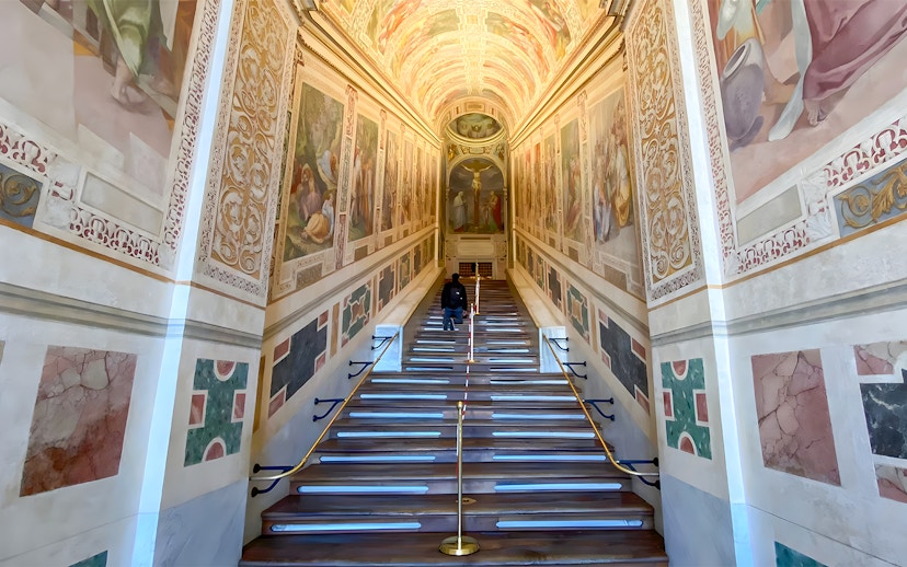 St. John Lateran Basilica interior staircase with frescoes in Rome, Italy.