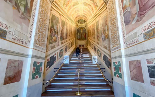 St. John Lateran Basilica interior staircase with frescoes in Rome, Italy.