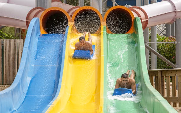Visitors enjoying water slides at Aquasplash Antibes.