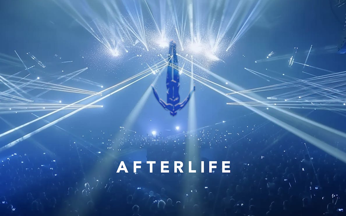 Crowd at Afterlife event with lights and anchor symbol, Hï Ibiza.