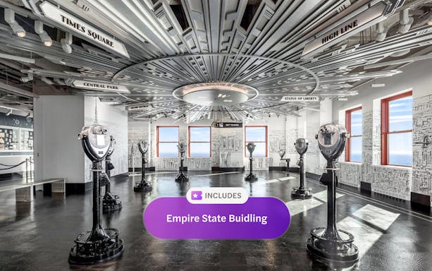 Empire State Building observatory interior with viewing binoculars and cityscape decor.
