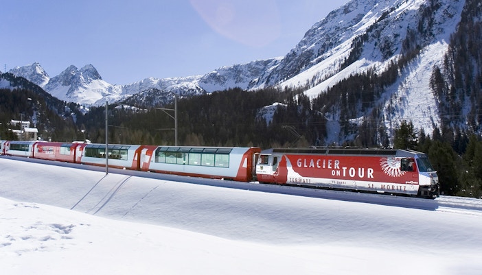 Glacier Express train journey through Swiss Alps from Zermatt to St. Moritz, scenic mountain views.