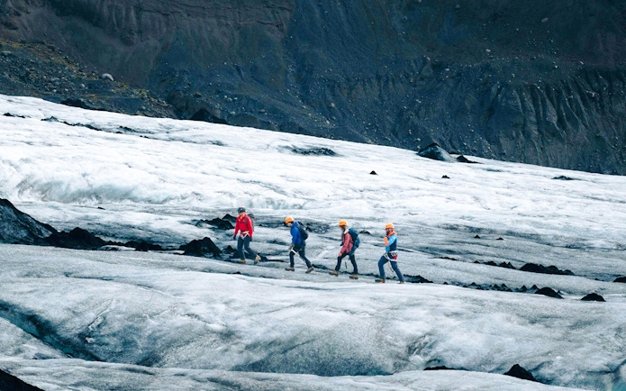 Guests hiking on Solheimajökill Glacier in Iceland.