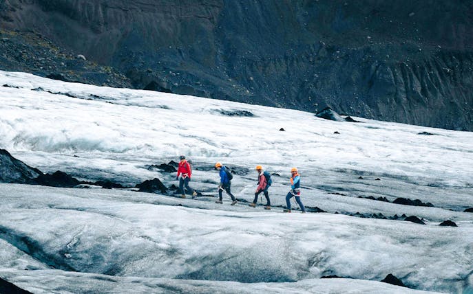 Guests hiking on Solheimajökill Glacier in Iceland.