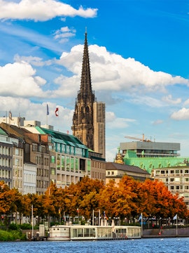 St. Nikolai Church spire and Alster Lake in Hamburg, Germany.