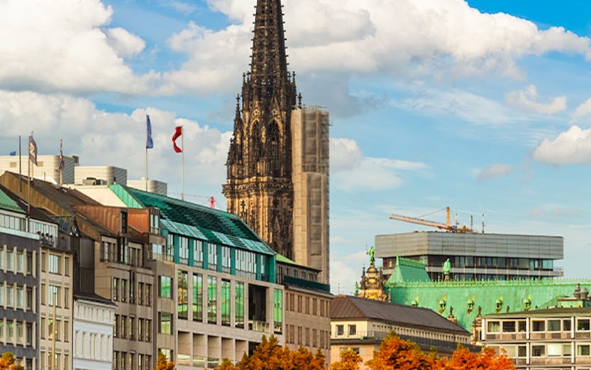 St. Nikolai Church spire and Alster Lake in Hamburg, Germany.