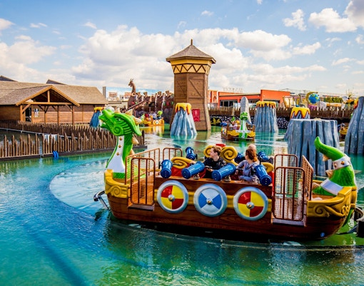 Children enjoying the Viking ride at Energylandia amusement park.