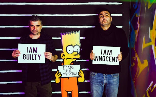 Thessaloniki Selfie Museum visitors posing with humorous signs and cartoon character.