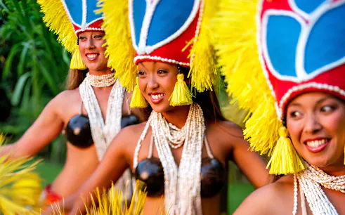 Hula dancers performing at Smiths Family Garden Luau in traditional attire.