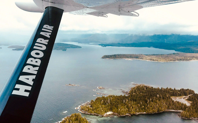 Seaplane view of coastal islands and forested landscape near Victoria.
