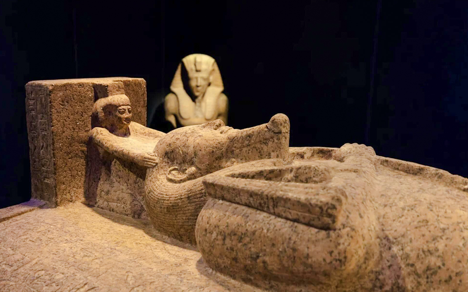 Ancient Egyptian sarcophagus with hieroglyphs at "Ramses and the Gold of the Pharaohs" exhibition, London.