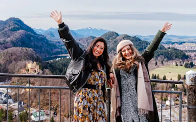 Tourists enjoying the view of Hohenschwangau Castle in Bavaria, Germany.