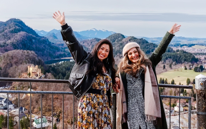 Tourists enjoying the view of Hohenschwangau Castle in Bavaria, Germany.