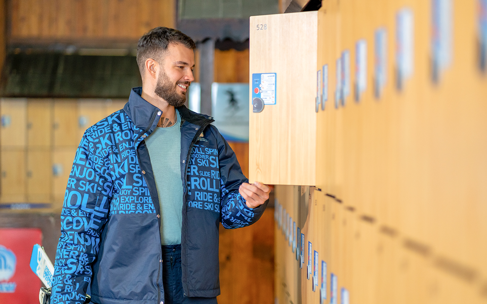 Man using locker at Ski Dubai Penguin Encounter.