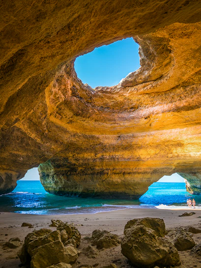 Benagil Cave with sunlight through skylight, Algarve, Carvoeiro, Portugal.