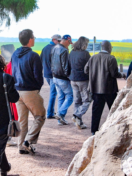 Group walking through Somme battlefields on a day trip from Paris.