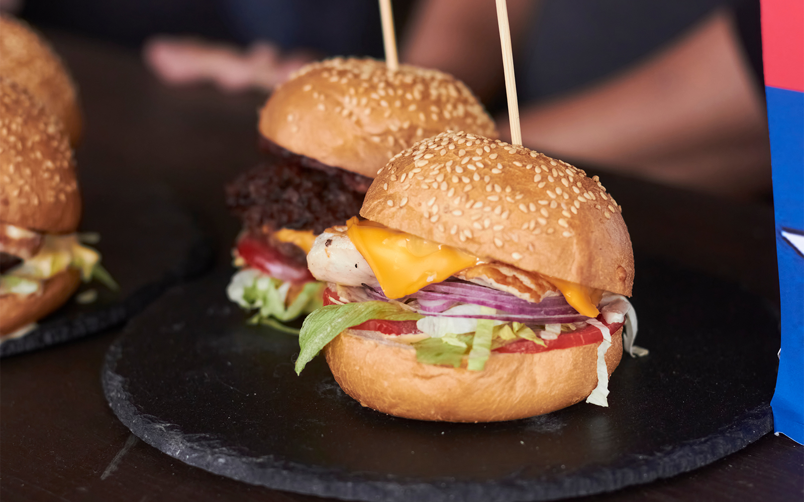 Burgers with cheese and vegetables at Disney Village Paris restaurant.
