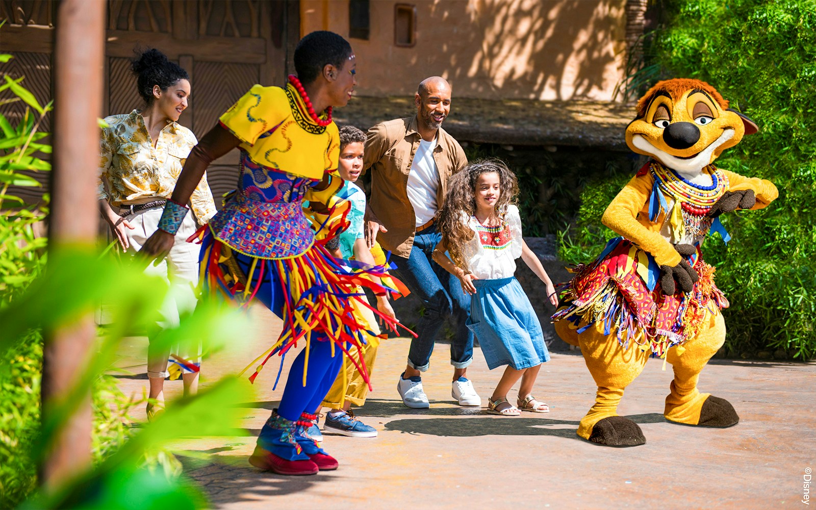Dancing with characters at Disneyland Paris.