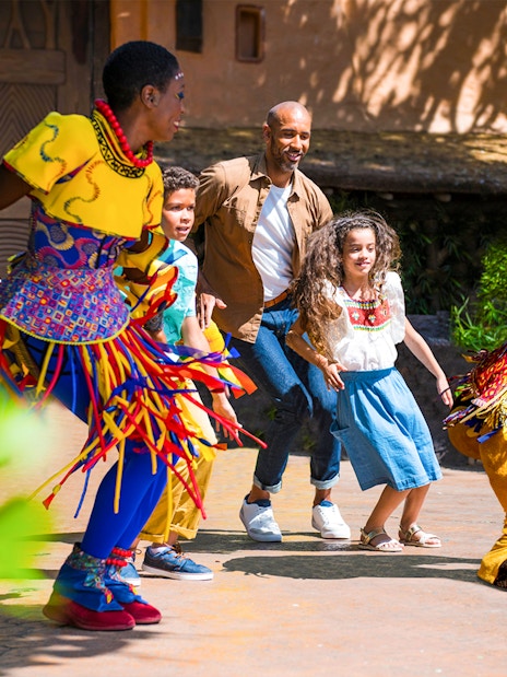 Dancing with characters at Disneyland Paris.