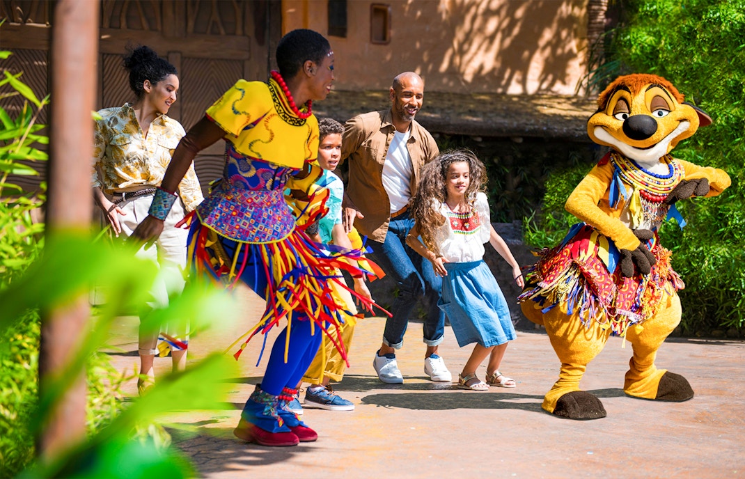 Dancing with characters at Disneyland Paris.